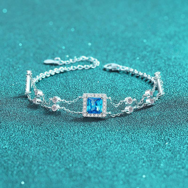 Sterling Silver Dual Chain Bracelet with Square-Cut Moissanite and Blue Gemstones in Leaf and Star Motifs